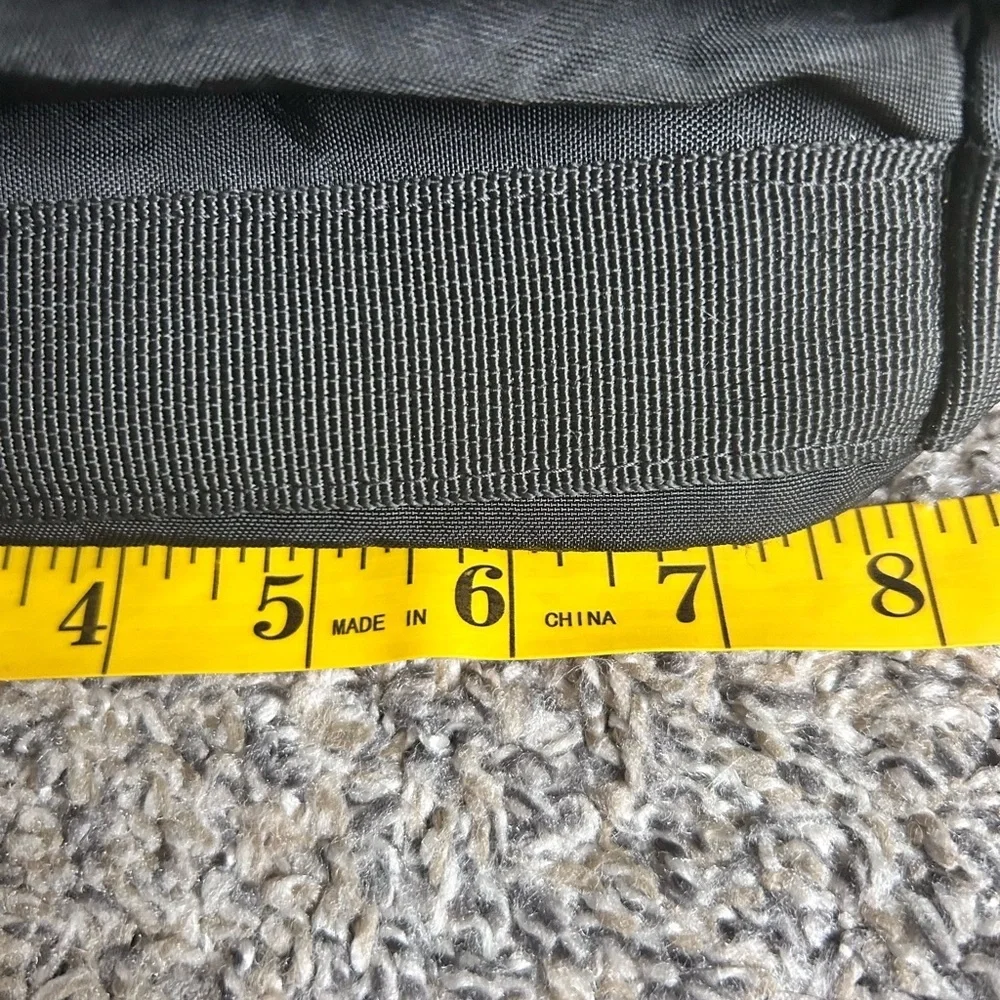 Tommy Bahama black travel duffle bag with hand and shoulder straps